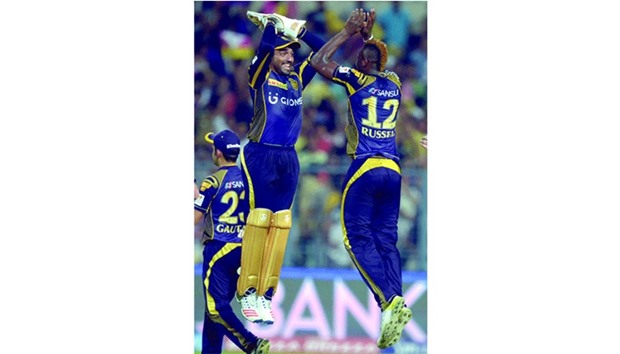 Kolkata Knight Riders cricketer Andre Russell (R) and wicket-keeper Robin Uthappa celebrate the fall of Delhi Daredevilsu2019 Shreyas Iyer during their Indian Premier League game in Kolkata yesterday.