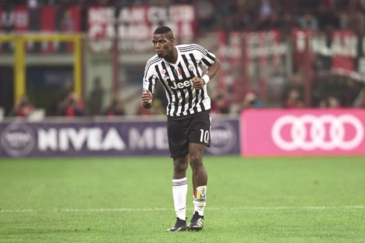 Juventusu2019 midfielder from France Paul Pogba celebrates after scoring a goal against AC Milan.