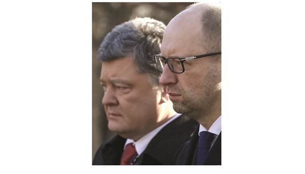 This picture taken on January 29 shows Ukrainian President Poroshenko (left) and Yatseniuk at a ceremony in Kiev to honour several hundred students who died during a battle on January 29, 1918 while defending the Ukrainian capital from the Bolsheviks.
