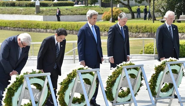 Germany's Foreign Minister Frank-Walter Steinmeier, Japan's Foreign Minister Fumio Kishida, US Secretary of State John Kerry, British Foreign Secretary Philip Hammond and Canada's Foreign Minister Stephane Dion offer a silent prayer at the Memorial Cenotaph for the 1945 atomic bombing victims in the Peace Memorial Park, on the sidelines of the G7 Foreign Ministers' Meeting in Hiroshima on Monday.