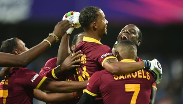 Lendl Simmons is held aloft by teammates as they celebrate after victory in the World T20 semi-final against India at the Wankhede Stadium in Mumbai.