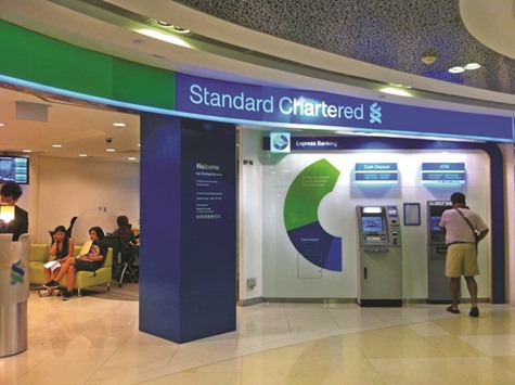 Standard Chartered is speaking with potential buyers for about $1.4bn of stressed loans made to Indian firms including GMR  Infrastructure, sources said yesterday.