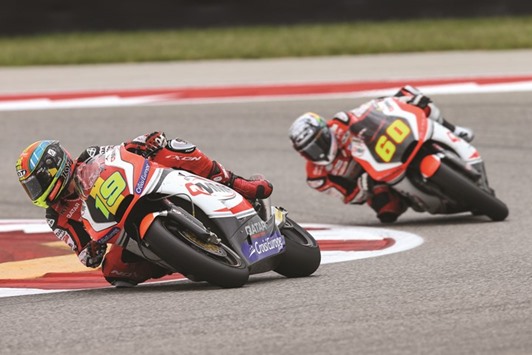QMMF Racing Team riders Xavier Simeon (foreground) and Julian Simon in action during the Moto2 race on Sunday.