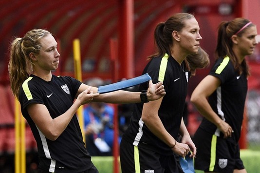 Defender Becky Sauerbrunn (left) has said the US womenu2019s football team could boycott the Olympic Games in Rio de Janeiro if demands to be paid the same as their male counterparts are not met. (AFP)