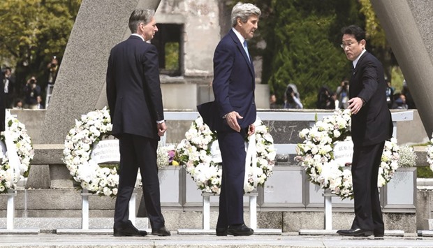Japanu2019s foreign minister Fumio Kishida shows the way to US secretary of state John Kerry and Britainu2019s foreign secretary Philip Hammond after laying wreaths at the Memorial Cenotaph for the 1945 atomic bombing victims in the Peace Memorial Park, on the sidelines of the G7 meeting in Hiroshima