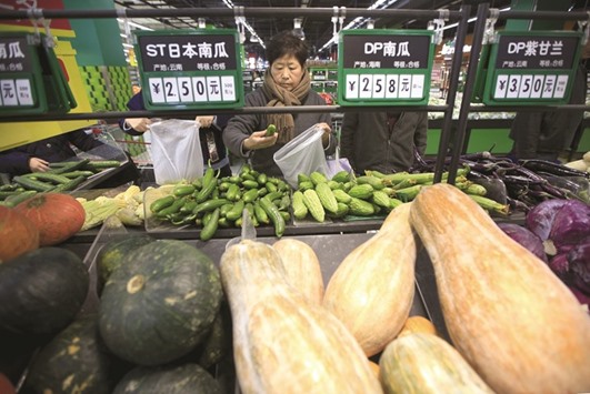 Consumers choose vegetables at a supermarket in Shanghai. Chinau2019s consumer inflation figures were driven by food price inflation of 7.6%, with fresh vegetable prices jumping 35.8% year-on-year.