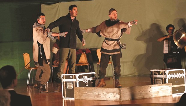 Actors from Britainu2019s Globe Theatre company perform in a production of William Shakespeareu2019s drama Hamlet at the British embassy in Kabul yesterday.