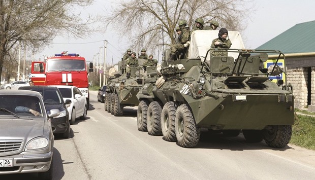 Russian soldiers secure a neighbourhood in Novoselitskoye, Stavropol region in southern Russia.