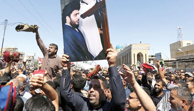 Supporters of Iraqi Shia cleric Moqtada al-Sadr shouting slogans during a protest against government corruption  in Baghdadu2019s Sadr City.