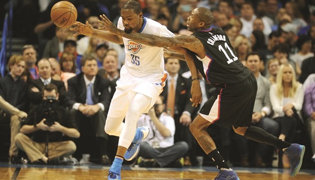 Los Angeles Clippers guard Jamal Crawford (R) attempts to steal the ball from Oklahoma City Thunder forward Kevin Durant during the second quarter. PICTURE: USA TODAY Sports
