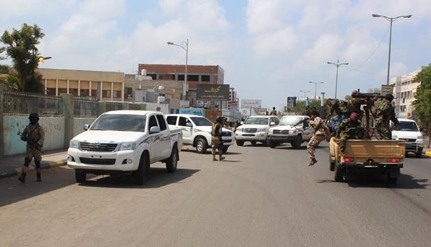 Yemeni troops arrive at the area where a suicide bomber killed five Yemeni soldiers on Tuesday.