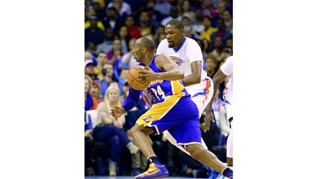 Kobe Bryant of the Los Angeles Lakers drives around Kevin Durant of the Oklahoma City Thunder during the first quarter of a NBA game at the Chesapeake Energy Arena on in Oklahoma City, Oklahoma. (Getty Images/AFP)