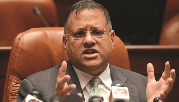 Sri Lankau2019s Central Bank governor Arjuna Mahendran gesturing as he was speaking to reporters in Colombo yesterday.