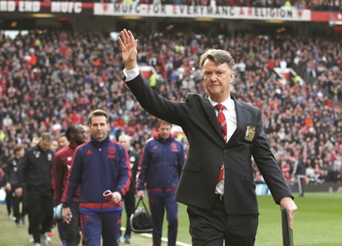 File picture of Manchester United manager Louis van Gaal waving to fans before a Barclays Premier League game.