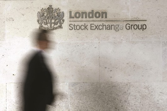A man walks past the London Stock Exchange in the City of London. Despite the IMFu2019s u201cBrexitu201d warning, Londonu2019s FTSE 100 index rose 0.7% yesterday.