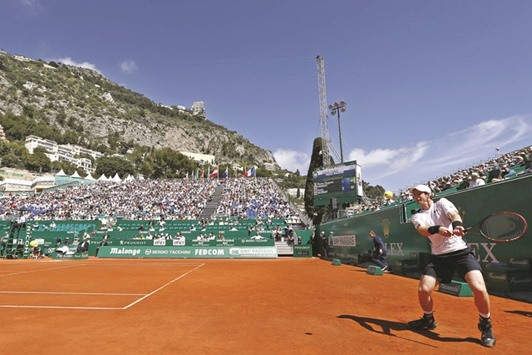 Britainu2019s Andy Murray returns the ball to Franceu2019s Pierre Hugues Herbert during the Monte Carlo Masters in Monaco yesterday. (AFP)