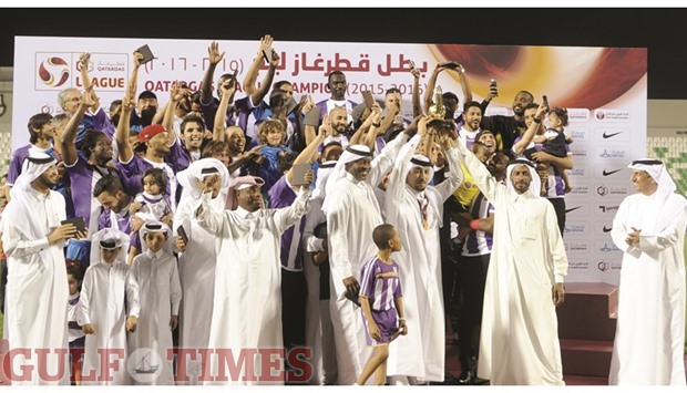 Muaither players and officials celebrate after being handed over the Qatargas League winnersu2019 trophy at Al Ahli Stadium on Monday evening. Sheikh Khalid bin Abdullah al-Thani, chief operating officer - Engineering & Ventures at Qatargas, and Qatar Football Association (QFA) Executive Committee member Ahmed al-Buainain were present on the occasion. PICTURES: Shemeer Rasheed