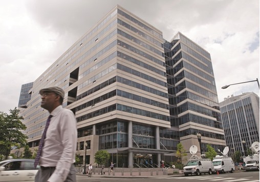 The headquarters of the International Monetary Fund is seen in Washington. The Fund cut its global forecast for the third straight quarter, saying economic activity has been u201ctoo slow for too long,u201d and called for immediate action by the worldu2019s economic powers to shore up growth.