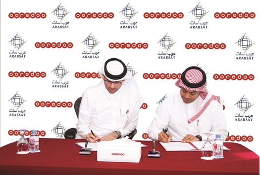 Ahmad Abdulaziz al-Neama, chief sales and service officer, Ooredoo Qatar and Wael al-Buti, director, sales and customer service at Arabsat, during the signing ceremony. Under the terms of the agreement, Ooredoo and Arabsat will look to collaborate on new VSAT services, as demand rises for the innovative technology in Qatar and across the region.