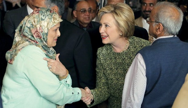 Democratic presidential candidate Hillary Clinton greets a community leader during a visit to the Jackson Diner Indian restaurant where she met with leaders of Asian immigrant communities in the Queens borough of New York.