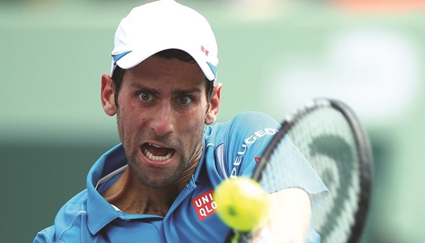 Novak Djokovic plays a backhand against David Goffin in their semifinal during the Miami Open in Key Biscayne, Florida. (AFP)