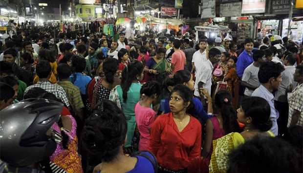 People crowd onto the street during an earthquake in Agartala, capital of India's northeastern state of Tripura. A magnitude 6.9 earthquake hit northern Myanmar on April 13, the United States Geological Survey said, as strong tremors were felt across northeastern India.