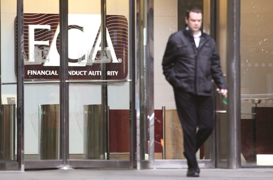 A visitor exits the offices of the Financial Conduct Authority in London. Banks unfairly favour big fund managers when it comes to doling out shares in company listings and this must change, the FCA said yesterday.