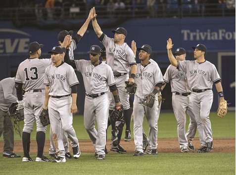 New York Yankees players celebrate their MLB win over Toronto Blue Jays at Rogers Centre in Toronto, Canada. (USA TODAY Sports)