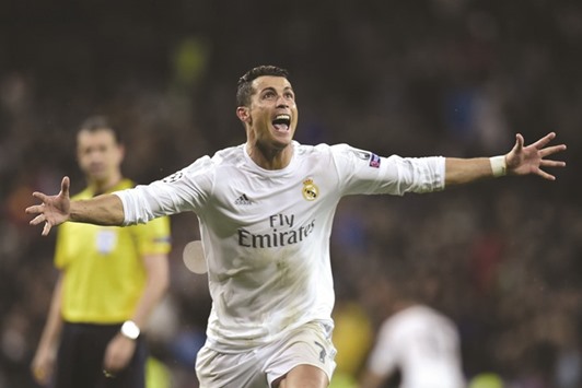 Real Madridu2019s Portuguese forward Cristiano Ronaldo celebrates after scoring his third goal during the Champions League quarter-final second leg against Wolfsburg.