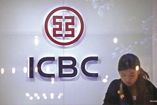 An employee at a branch of the Industrial and Commercial Bank of China works behind the counter in Sydney. Total loans by Chinese banks that operate in Australia grew by more than 36% in the year to end-February compared with a 9% growth in loans overall, according to the latest Australian government data.