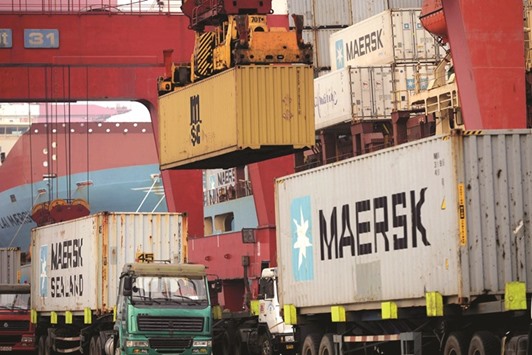 Trucks transporting containers at a port in Qingdao, Shandong province. Chinau2019s exports in March returned to growth for the first time in nine months, adding to further signs of stabilisation in the worldu2019s second-largest economy that cheered regional investors.