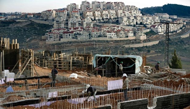 Palestinian labourers working at a construction site in the Israeli settlement of Efrat on the outskirts of Bethlehem in February.