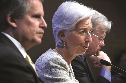 IMF managing director Christine Lagarde (centre) speaks as first deputy managing director David Lipton (left) and communications director Gerry Rice listen during a news conference yesterday in Washington. Lagarde warned that Brexit is a leading risk to growth and it could do severe regional and global damage by disrupting established trading relationships.