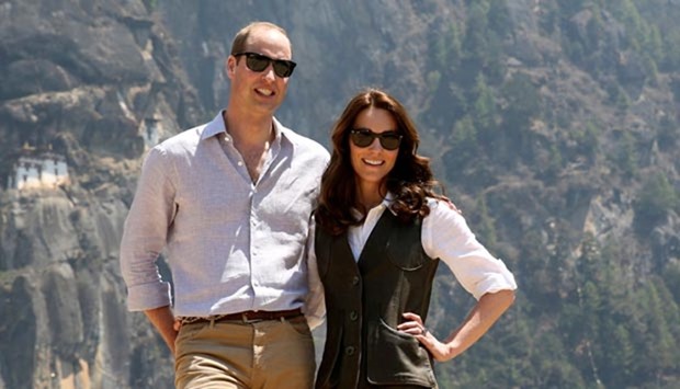 Prince William, Duke of Cambridge, poses with his wife Catherine, Duchess of Cambridge, in front of the Taktsang Palphug Monastery in Bhutan on Friday.