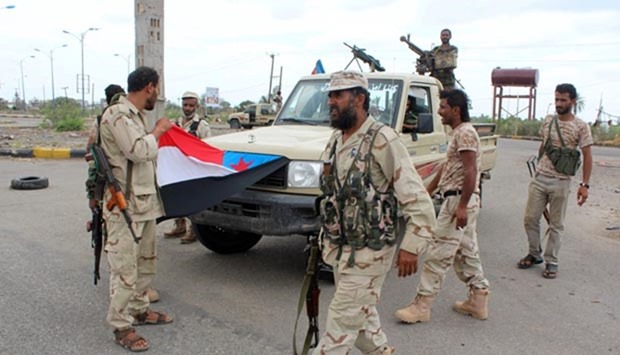 Yemeni loyalist forces monitor an area in the town of Lahej, 30km from Aden, on Friday.
