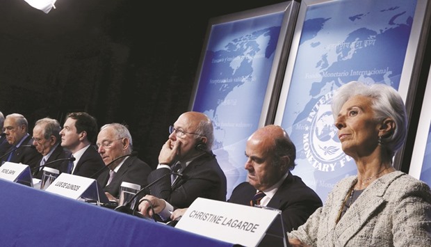 From left: OECD secretary general Jose Angel Gurria, Italyu2019s Finance Minister Pier Carlo Padoan, Britainu2019s Chancellor of the Exchequer George Osborne, Germanyu2019s Finance Minister Wolfgang Schaeuble, Franceu2019s Finance Minister Michel Sapin, Spainu2019s Finance Minister Luis de Guindos and International Monetary Fund managing director Christine Lagarde hold a news conference at the IMF-World Bank Spring Meetings in Washington yesterday.