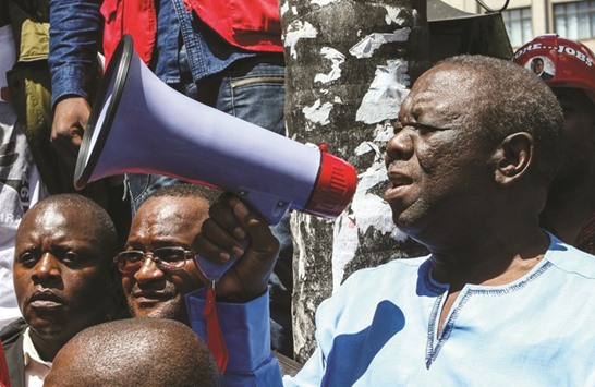 MDC president Tsvangirai speaking into a megaphone as he addresses supporters during a demonstration by the opposition party in Harare on Thursday.