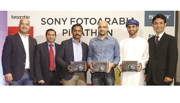 Three of the first prize winners are seen with FotoArabia, Darwish Technology and Sony officials.