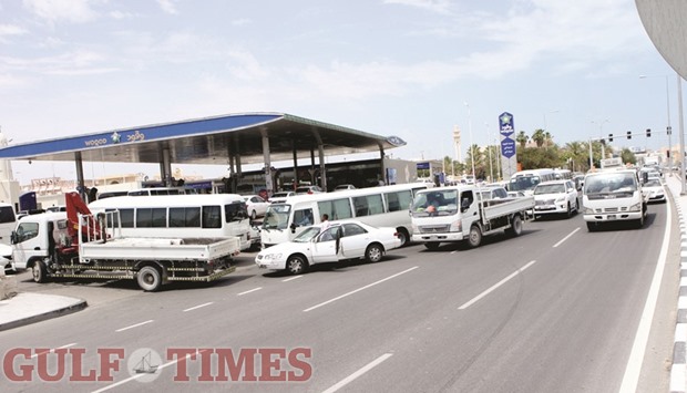 A long queue of vehicles at a petrol station in Doha blocks traffic on the road. PICTURE: Nasar T K