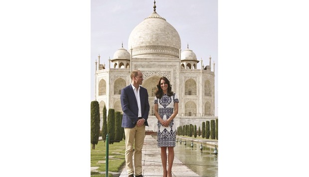 Britainu2019s Prince William and his wife Catherine, the Duchess of Cambridge, pose at the Taj Mahal yesterday.