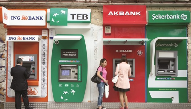 A line of automated teller machines operated by ING Bank, Turk Ekonomi Bankasi (TEB), Akbank, and Sekerbank, sit on the high street in the Beyoglu district of Istanbul, Turkey. Analysts looking beyond the depressed valuations point to risks to the industryu2019s profitability from slowing loan growth and more costly regulatory requirements.