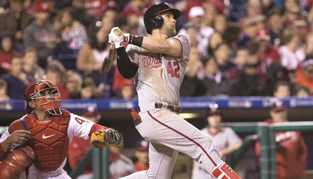 Washington Nationals right fielder Bryce Harper hits a two RBI home run in front of Philadelphia Phillies catcher Carlos Ruiz (left) during the sixth inning of their game at Citizens Bank Park in Philadelphia, Pennsylvania. (USA TODAY Sports)