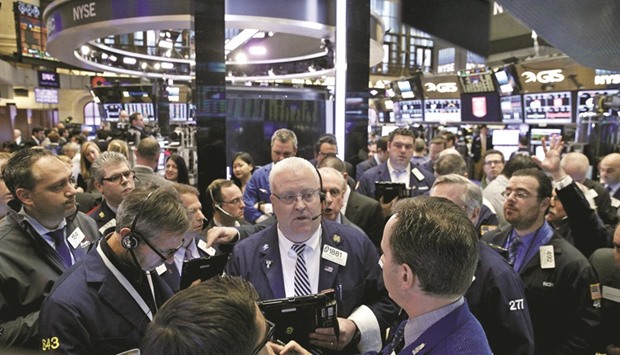 Traders work on the floor of the New York Stock Exchange (file). A turnaround in profits would blunt one of investorsu2019 biggest worries, an ongoing weak earnings cycle. The S&P 500 has recovered from a sharp early-year selloff and is up 1.8% year to date, while its price-to-earnings ratio is above its long-term average.
