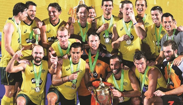 Australian players pose with the trophy after defeating India during the final of the 2016 Sultan Azlan Shah tournament at Azlan Shah stadium in Ipoh. (AFP)