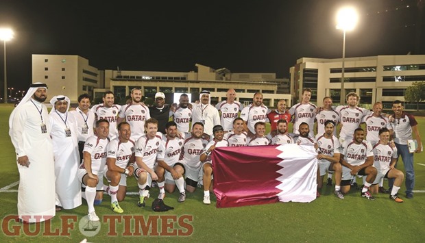 Qatar Rugby Federation (QRF) president Yousef al-Kuwari, general secretary Ali al-Malki and senior co-ordinator Samuel Rico with the victorious Qatar team after the 35-12 win over Iran at the Aspire Warm Up and Purpose-Built Rugby Track yesterday.