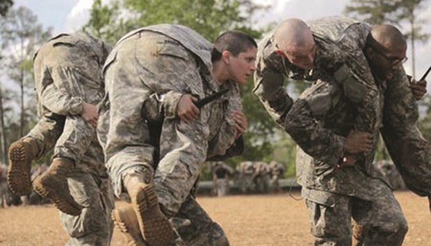 Then-US Army First Lieutenant Kirsten Griest (centre) and fellow soldiers participate in combat training during the Ranger Course on Fort Benning, Georgia in this 2015 file photo.
