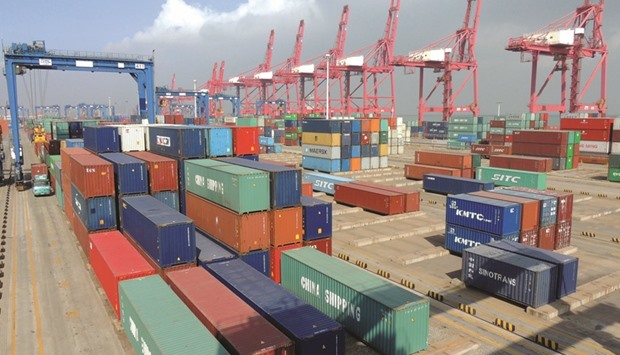 Containers are seen at a port in Jiangsu province. Chinese leaders appear to have stabilised their $10tn-plus economy by relying on a tried and true playbook: unleash a torrent of credit to power a borrowing surge and spending splurge.