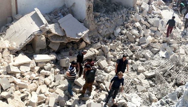 Residents look for survivors amidst the rubble after an airstrike on the rebel-held Old Aleppo, Syria, yesterday. Reuters