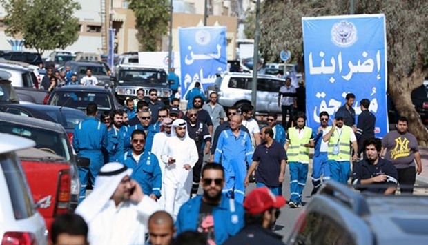 Kuwaiti oil workers are seen at the union headquarter in Al-Ahmadi, 35 km south of Kuwait City, on Sunday to protest against alleged pay cuts and plans to privatise parts of the oil sector.