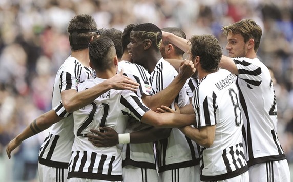Juventus players celebrate their 4-0 win over Palermo yesterday. (Reuters)